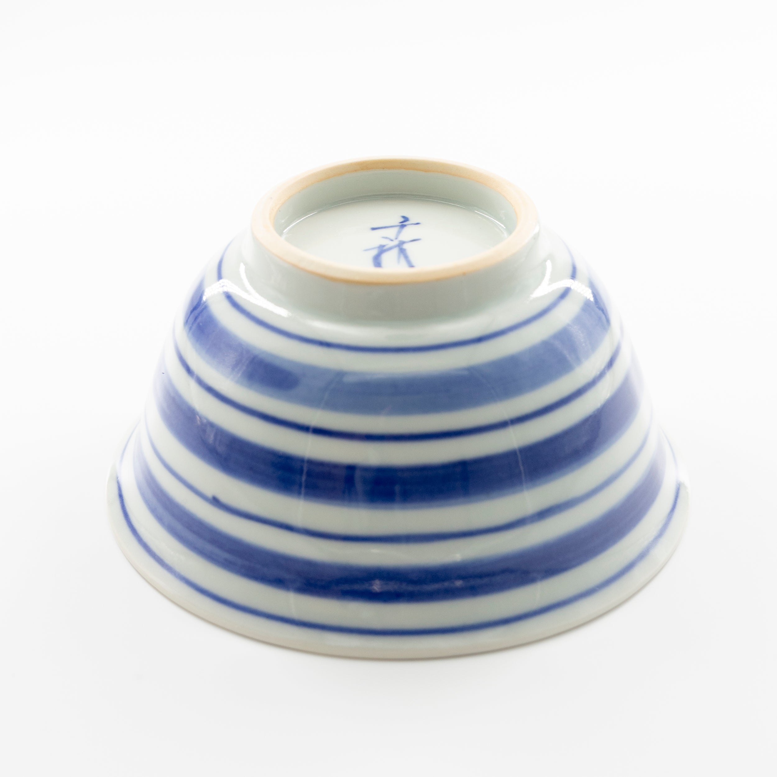 Blue and white bowl with spinning top motif