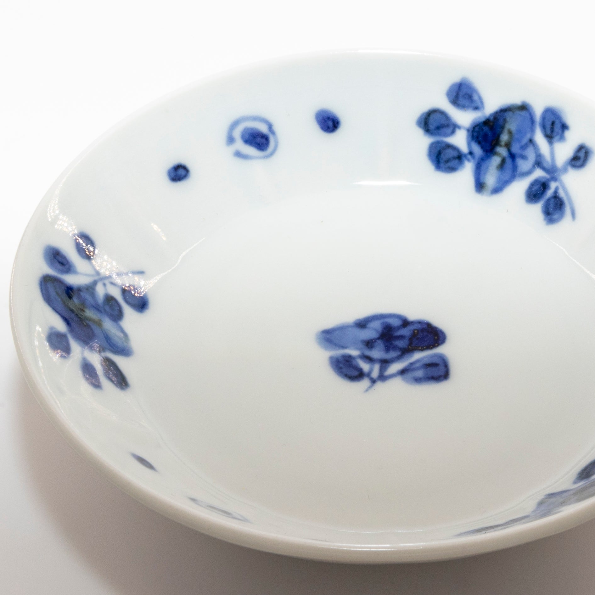 Small plate with blue and white floral motif