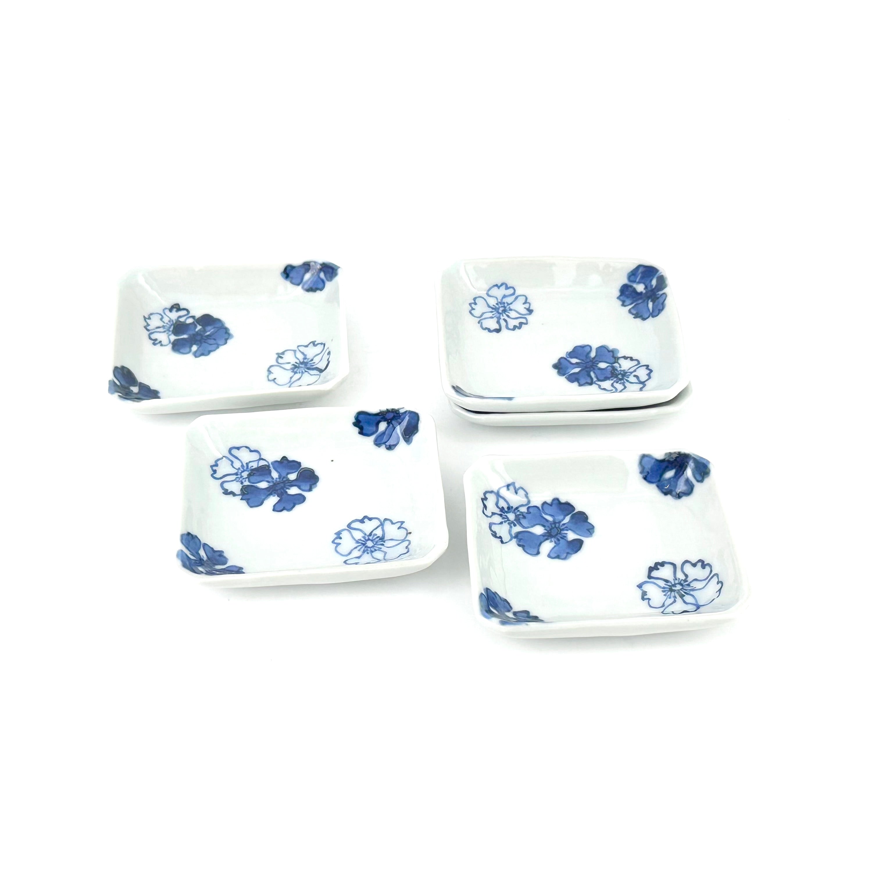 Blue and white small plate with cherry blossom pattern and corner